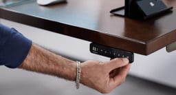 Black Advanced Comfort Flush Keypad on an UPLIFT height adjustable desk.