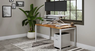 ATX Standing Desk Converter in standing position with 60" x 30" Dark Pecan Custom Solid Wood Seated Height O-Leg Table