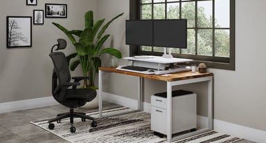ATX Standing Desk Converter in seated position with 60" x 30" Dark Pecan Custom Solid Wood Seated Height O-Leg Table