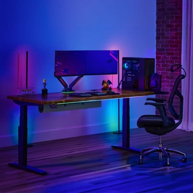 UPLIFT V3 Standing Desk with a Saman Butcher Block desktop and a J3 Ergonomic Chair