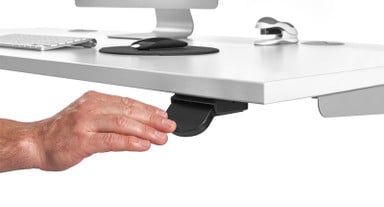 Press down on the paddle to lower your standing desk