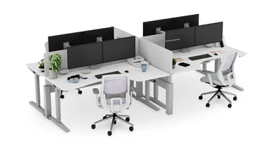 Shown with the V2 frame. Group Curved Corner Standing Desks together in space-efficient office configurations with the Power & Data Rail