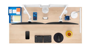 Range-X Dual Monitor Arm mounted to a Maple Laminate desktop