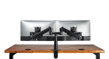 Clamping the arm on the back edge of a desk is the simplest and most common mounting method