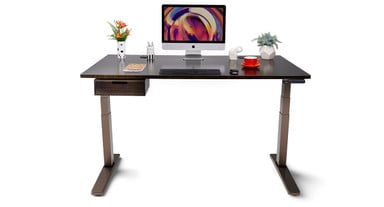 UPLIFT 2-Leg Standing Desk in Industrial with a Black Bamboo desktop.
