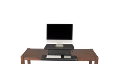 The Standing Desk Converter counterbalances to support the weight of your accessories