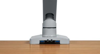 The Crestview Monitor Arm Wiring Kit adds two USB ports and audio jacks to the base of the monitor arm