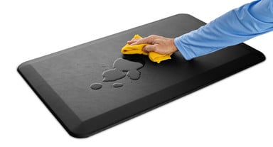 The mat's durable surface repels spills and is easy to clean