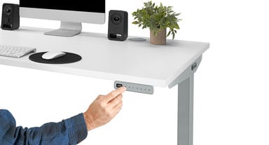 A raised molded divider between the buttons offers tactile feedback for no-look desk adjustment
