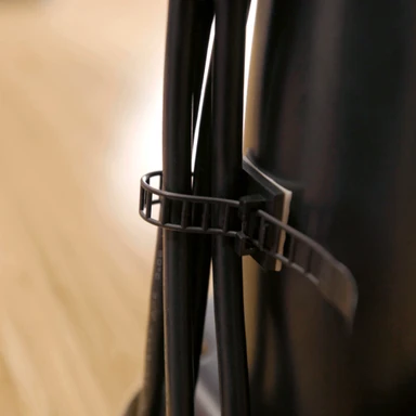 Self-adhesive cable mounts with re-adjustable ties allow you to bundle cords underneath your desk frame