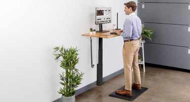 This small adjustable desk's height range enables an ideal ergonomic desk posture for most people 5' to 6'3" tall