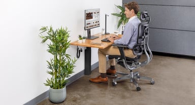 Change from sitting to standing at this small computer desk regularly throughout the day for optimal health
