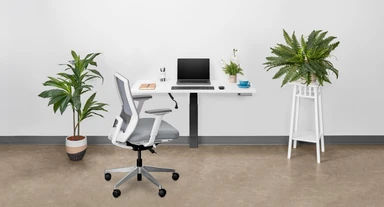 The elimination of desk legs resting on the floor below this desk for small spaces opens up the area below for floorspace savings