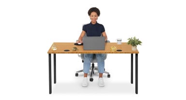 Table legs are positioned at the outer edges of the tabletop to create plenty of usable space beneath
