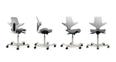 Capisco Puls with Light Gray plastic, fully upholstered seat, and silver base. Upholstery: Era Generation