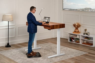 Rear view of a 60" x 30" Rustic Walnut Solid Wood UPLIFT Narrative Standing Desk