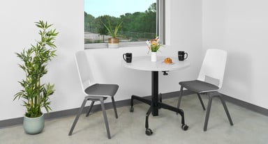 The Height Adjustable Bistro table, shown with a round top, is perfect for break rooms and cafeterias.