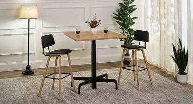 Perfect for lounges, raise the Bistro Table to bar height for elevated seating