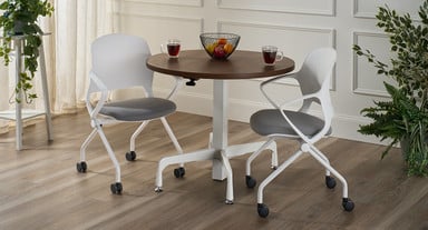 A round Height Adjustable Bistro table paired with Rollaway Nesting Chairs adds style and flexibility to break areas.