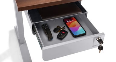 Store mobile devices, keys, wallets, and more in the securely locked drawer