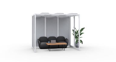 UPLIFT Spaces Coves create focus nooks for small group seclusion. White frame, full glass and light gray acoustic PET panels, light gray ceiling baffles, UPLIFT Desk Dillo chairs in dark gray, and UPLIFT Slimline coffee table