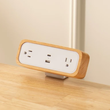 The DuoMount Power Strip in White with a Beech Wood accent