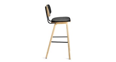 A blend of durable formed wood and powder-coated steel creates the barstool's sleek, modern design