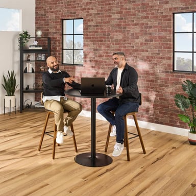 Collaborate in comfort at bar height with dark oak Kerbey Barstools