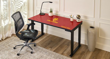 4-Leg collegiate standing desk with USC Trojan branding in a home office