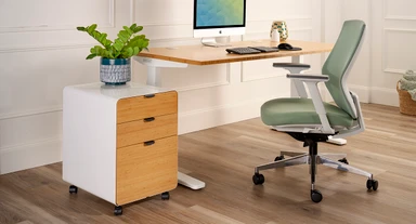 Modern office space featuring an UPLIFT Desk file cabinet with natural bamboo drawer fronts as the central focal point