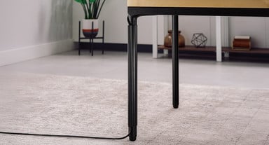 Included snap-on cable channel routes the desk's power cable cleanly to the nearest outlet
