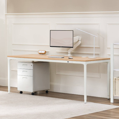The Parsons Standing Desk in white with a Maple Laminate desktop adds warmth and modern style to any office