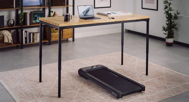 Warm wood tones and architectural black accents meet, creating a sophisticated environment designed for both productivity and movement