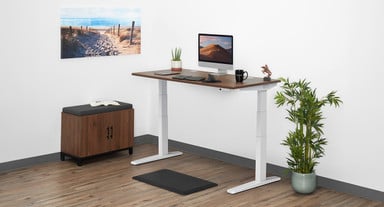 UPLIFT 2-Leg Standing Desk in white with a Walnut Heights Custom Laminate desktop
