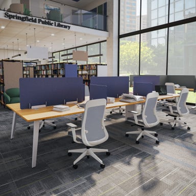6-person desk by UPLIFT Desk featuring acoustic panels to create individual workspaces