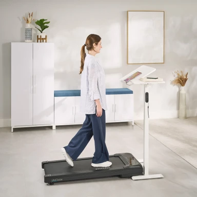 Pair the Sidekick Adjustable Table with an Inclining Walking Pad to add more movement to your day