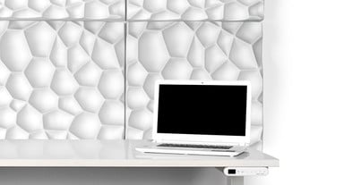 Concave pockets absorb sound and add a visually interesting element to blank walls