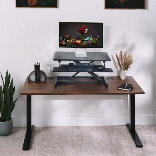 The Lady Bird Standing Desk Converter has an adjustable height range to fit users between 4'10" to 6'1"