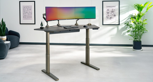 120-Degree height adjustable UPLIFT Desk on an industrial frame with a laminate desktop and accessories