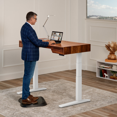 A 60" x 30" Rustic Walnut Solid Wood UPLIFT Narrative Standing Desk