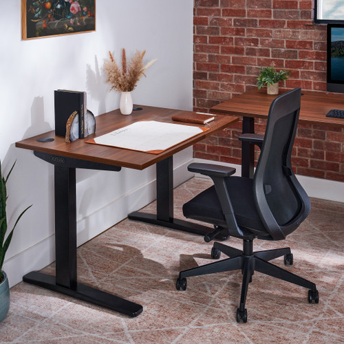 Create dual workstations by adding a side table to a standing desk