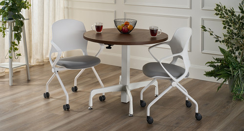 A round Height Adjustable Bistro table paired with Rollaway Nesting Chairs adds style and flexibility to break areas.