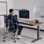 UPLIFT V3 Standing Desk with a Dark Rubberwood desktop and an Intuition Ergonomic Chair