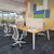 4-Person Table in an open space office featuring Bolan office chairs and acoustic privacy panels