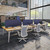 6-person desk by UPLIFT Desk featuring acoustic panels to create individual workspaces