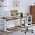 UPLIFT V3 Standing Desk with a Walnut Butcher Block desktop, a Vert Ergonomic Chair, and a MoPac Wardrobe in Walnut Laminate
