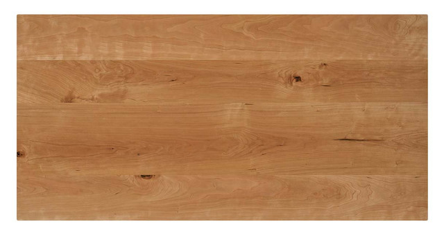 A wooden desk top with two black circular ports near the top edge, similar to index 6.