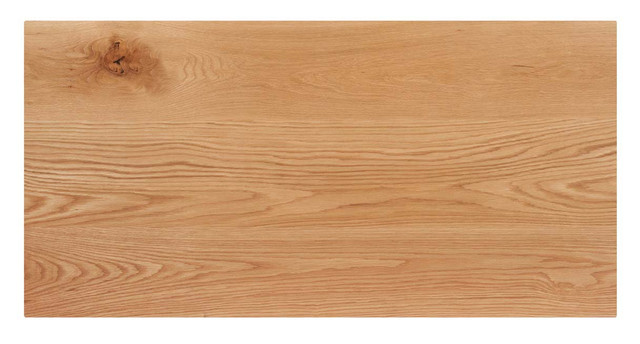 A wooden desk top with a more uniform wood grain and a single knot visible.
