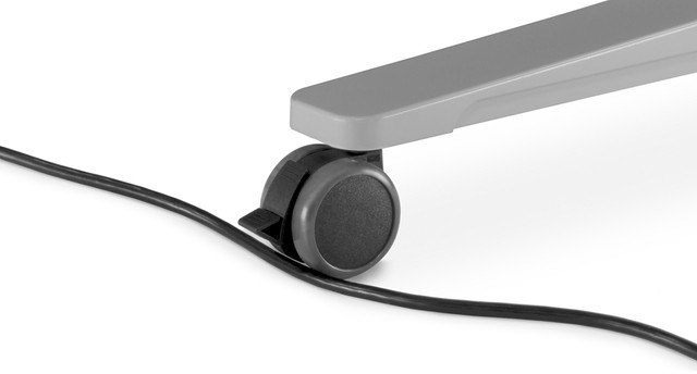 Caster wheel with power cord running under it