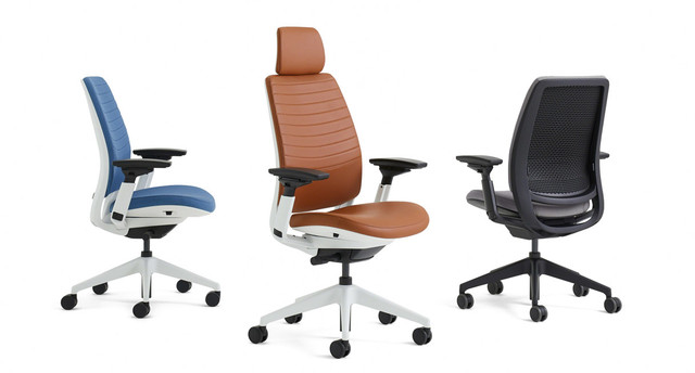 Close-up of a brown leather office chair back and headrest.